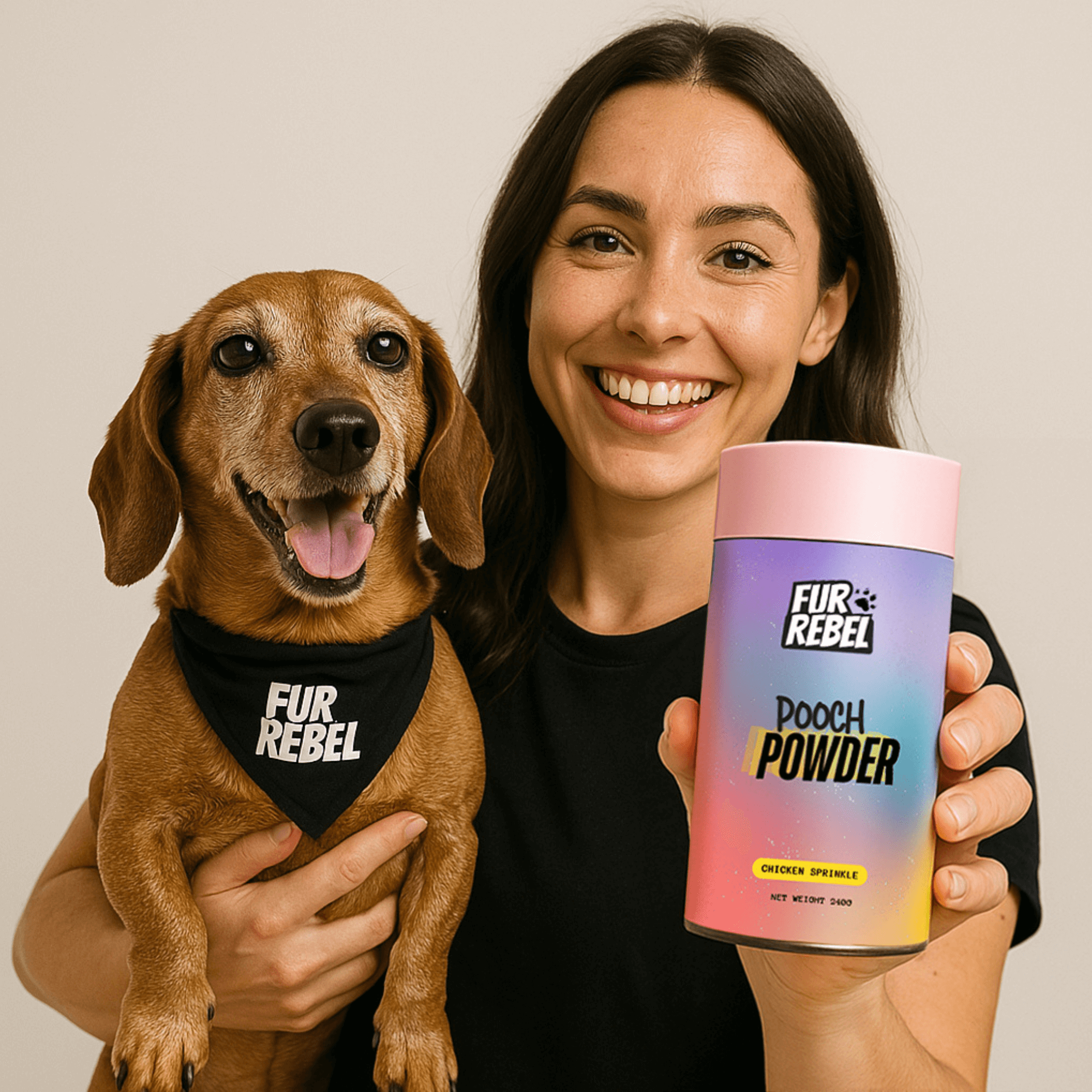 Main Mascot Woman holding a dog and a container of Fur Rebel Pooch Powder  dog supplement against a plain background